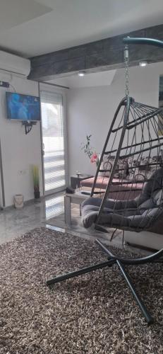 a room with a hanging bed in a room at APARTMENTS IVANOViC CENTER CITY in Bajina Bašta