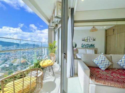 a bedroom with a balcony with a view of the city at The Song Luxury Apartment Vung Tau - Siêu ưu đãi chỉ có trong tuần nay in Vung Tau