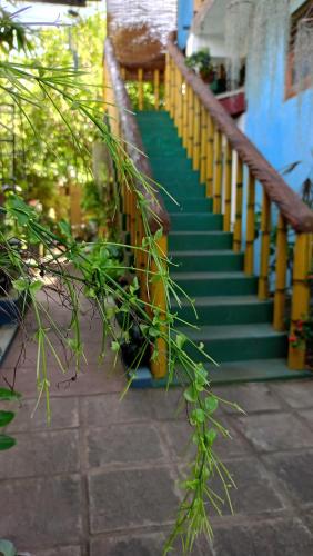a stairway with green and yellow stairs in a house at Raj Mahal Inn in Wadduwa