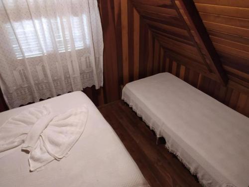 Postel nebo postele na pokoji v ubytování Chalé Represa Varanda do Sol Joanópolis