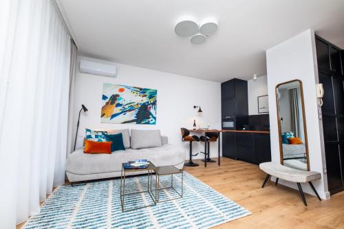 a living room with a couch and a table at City Sky Lodge in Budapest