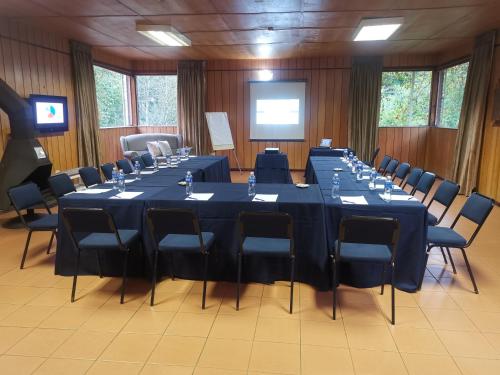 a conference room with a long table and chairs at Kings Lodge Hotel in Hogsback