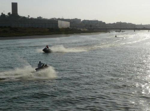 a person on a jet ski in the water at Entire home in Salé close to Rabat, Marina, beach in Sale