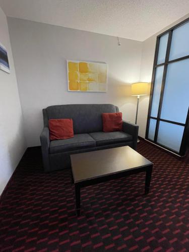 a living room with a couch and a coffee table at Comfort Suites Altoona North in Altoona