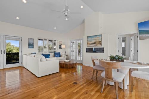 a living room with a couch and a table at Panferio SeaCret in Pensacola Beach