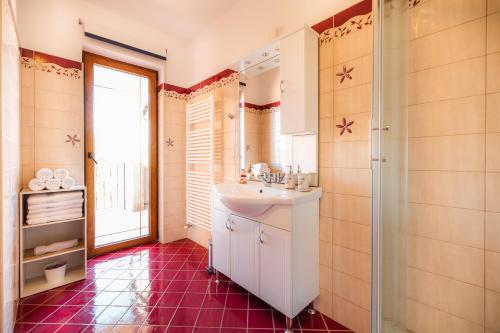 a bathroom with a sink and a mirror at KIŽIN House, Cozy apartments by Istrian Embrace in Brezovica pri Gradinu