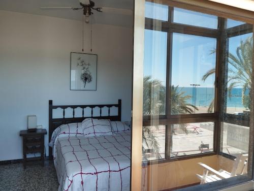 Ένα ή περισσότερα κρεβάτια σε δωμάτιο στο Primera linea playa