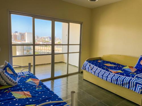 En eller flere senge i et værelse på Casa para Temporada