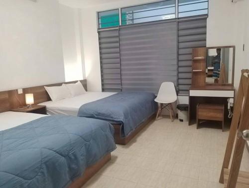 Postel nebo postele na pokoji v ubytování T-House 304