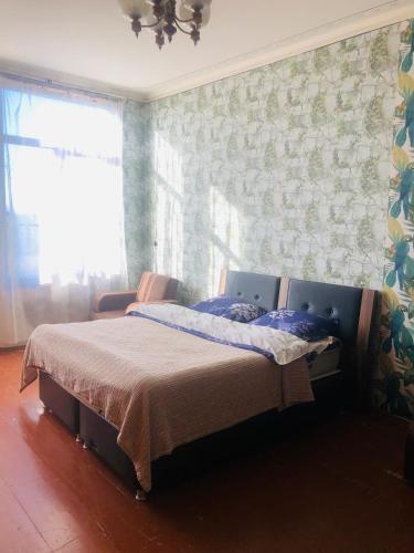 Postel nebo postele na pokoji v ubytování Shonikebi Guest House