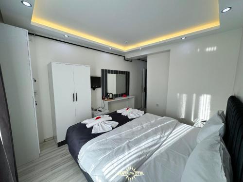 Кровать или кровати в номере Vantalya Otel