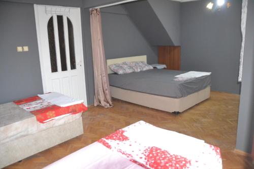 a bedroom with a bed and a couch in a room at Huzur 3 in Edirne