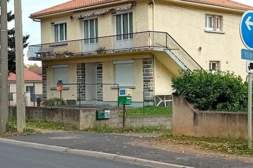 a building with a staircase on the side of it at coin tranquille in Pont-du-Château