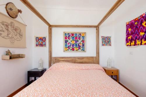 a bedroom with a bed and two tables and a window at VILLA ATRIS in Borghetto di Vara