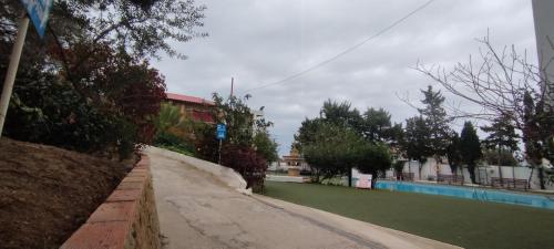 an empty street next to a swimming pool at Résidence Nardina Golden in Tetouan