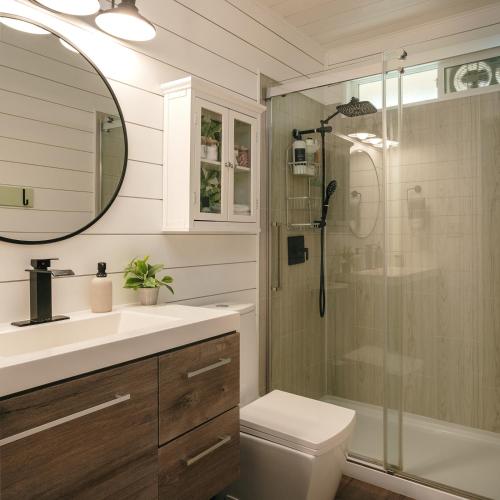 a bathroom with a shower and a toilet and a sink at The Alani at Kona Shores in Kailua-Kona