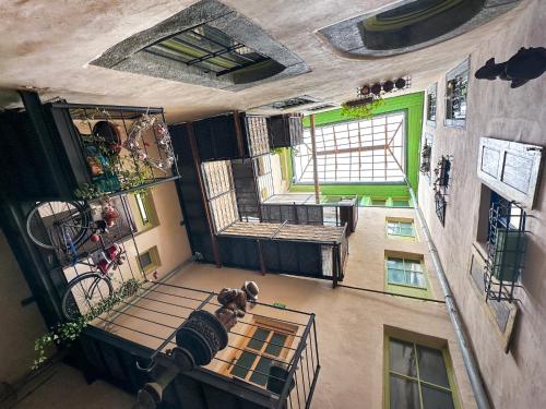an overhead view of a building with a room with windows at Apartmány MÚDRA SOVA in Banská Štiavnica