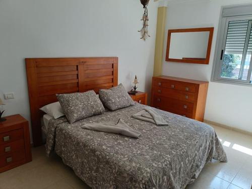 Ein Bett oder Betten in einem Zimmer der Unterkunft El Roque de Garachico