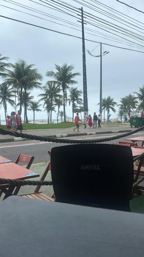 a laptop computer sitting on top of a table at Apartamento Praia Pitangueiras in Guarujá