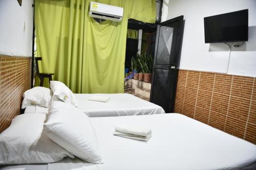 Postel nebo postele na pokoji v ubytování Hotel Kamellon