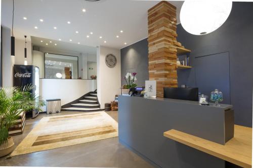 a lobby of a store with a reception counter at Hotel Doria in Genova