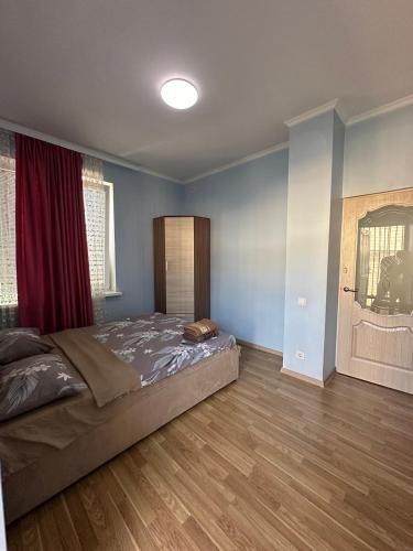 Katil atau katil-katil dalam bilik di BUIUCANI APARTAMENTS & TAXI AiRPORT