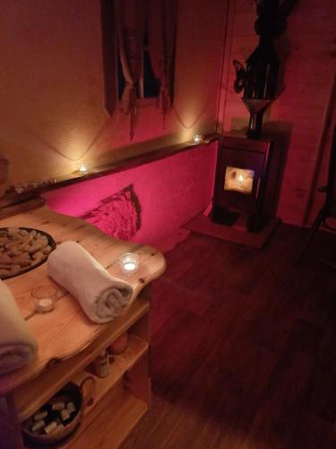 a room with a bath tub and a stove at Edenski vrt in Ivančna Gorica