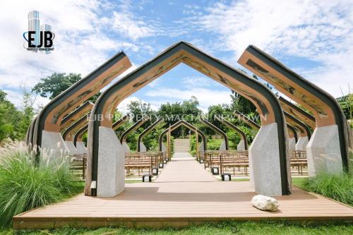 a wooden walkway leading to a wedding ceremony at Mactan Newtown Beach Condo in Mactan