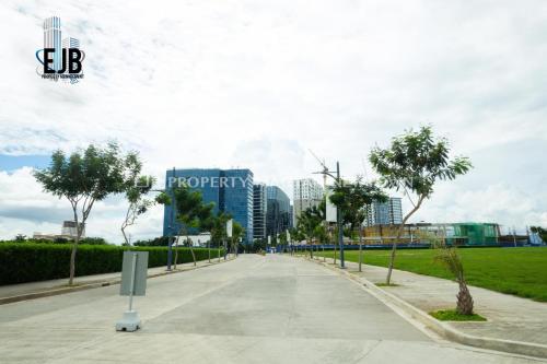 a street in a city with tall buildings at Mactan Newtown Beach Condo in Mactan