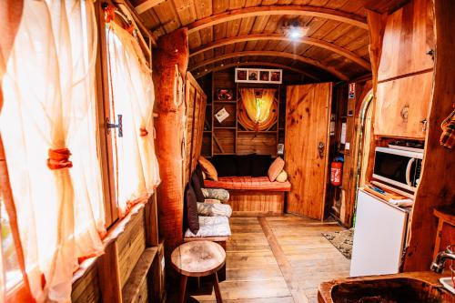 a room with a couch and a table in a tiny house at West Indies Cottage in Pointe-Noire