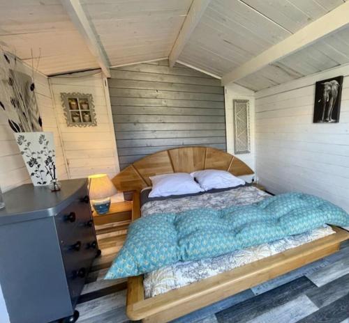 a bedroom with a large bed in a room at Charmante et accueillante maison in Saint-Pierre-dʼOléron