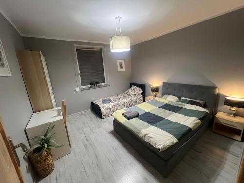 Ένα ή περισσότερα κρεβάτια σε δωμάτιο στο Apartament Antonio