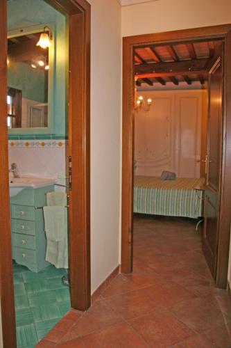 a bathroom with a sink and a mirror at Casa Dolce Acqua in Capannori