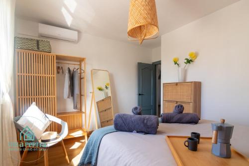 Postel nebo postele na pokoji v ubytování Villa Pepita