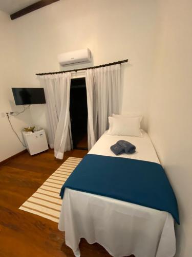 Postel nebo postele na pokoji v ubytování Aponem Spa & Pousada
