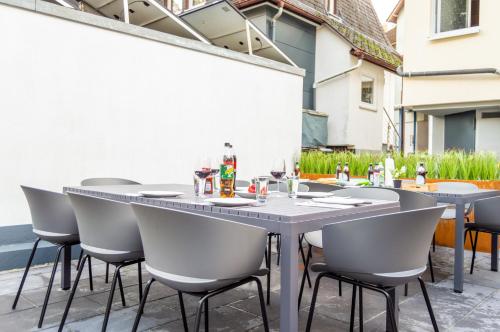 a table and chairs sitting on a patio at Designerwohnung nahe der Wasserfälle in Triberg