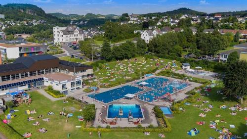 an aerial view of a resort with a pool at Ferienhaus am Berg in Hohenfels-Essingen