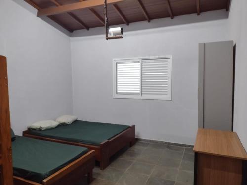 Postel nebo postele na pokoji v ubytování Chácara Aconchego Cotia - Vargem Grande Paulista