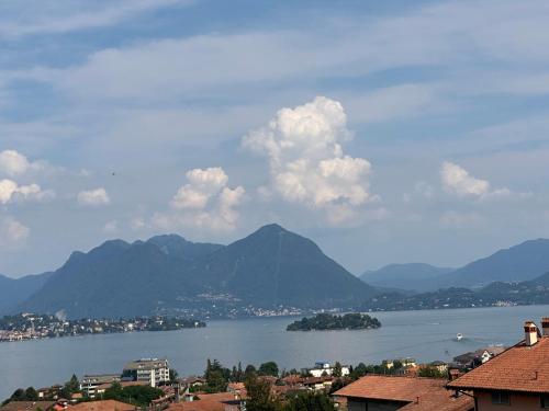 a view of a large body of water with mountains at Villa Sofia in Baveno