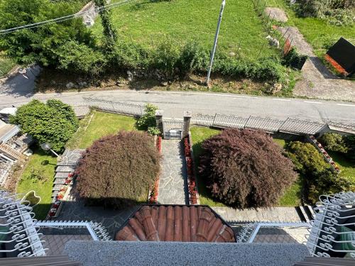 an aerial view of a park with two trees and chairs at Villa Sofia in Baveno