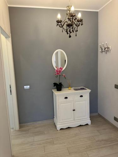 a room with a white cabinet and a mirror at Villa Sofia in Baveno