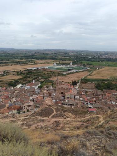 a small village on a hill with a river at Casa Carmen in Alcolea de Cinca