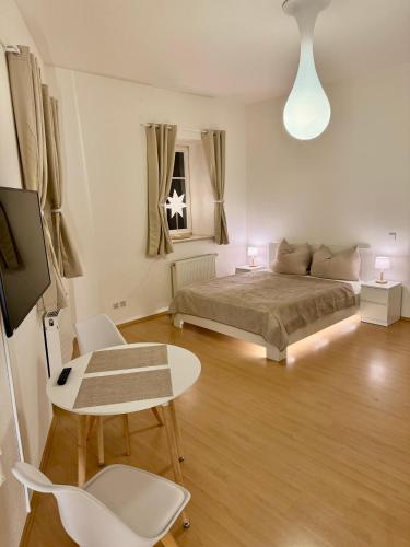 Foto Ferienwohnung Schildblick Modernes Apartment direkt in der Altstadt von Erfurt nahe der Krämerbrücke - beste Innenstadtlage 2