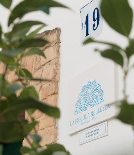 a label for a bottle of japonica ballemia on a building at La Piccola Bellezza in Pisticci