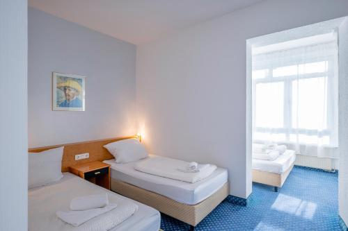 Hotel Viktoria Düsseldorf-Neuss - Self Check-Inにあるベッド