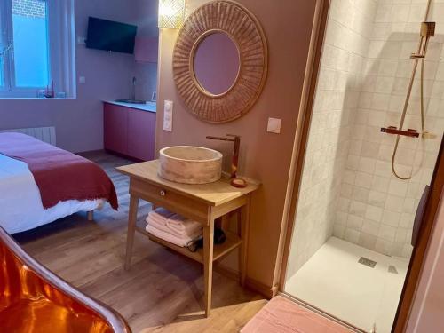 a bathroom with a sink and a shower at Les secrets de la baie - La Romana - évasion relaxante hammam et Spa privatif in Étaples