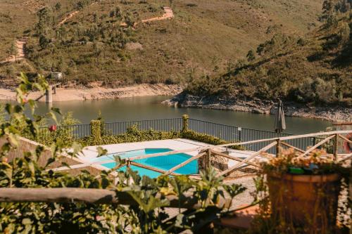 a view of a river with a swimming pool at Vilas da Matagosa in Matagosinha