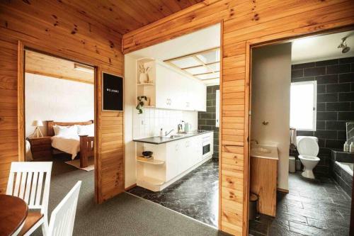 a kitchen with a sink and a bathroom at Spacious two bedroom apartment with mountain views in Mount Beauty
