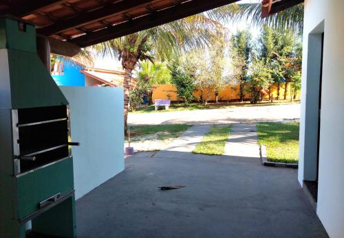 an open door of a building with a driveway at Temporada Belas Casas in São Pedro