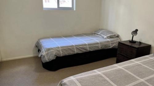 Ένα ή περισσότερα κρεβάτια σε δωμάτιο στο Surfside One Unit 1